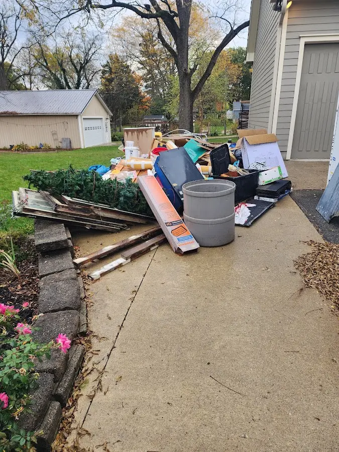 Dumpster being loaded with debris for Demolition Dumpster Rental in Valley City